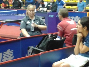 Sue looks pensive as she talks to her coach Neil