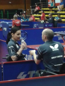 Greg calls a time out for Jane at 4-4 in the third set
